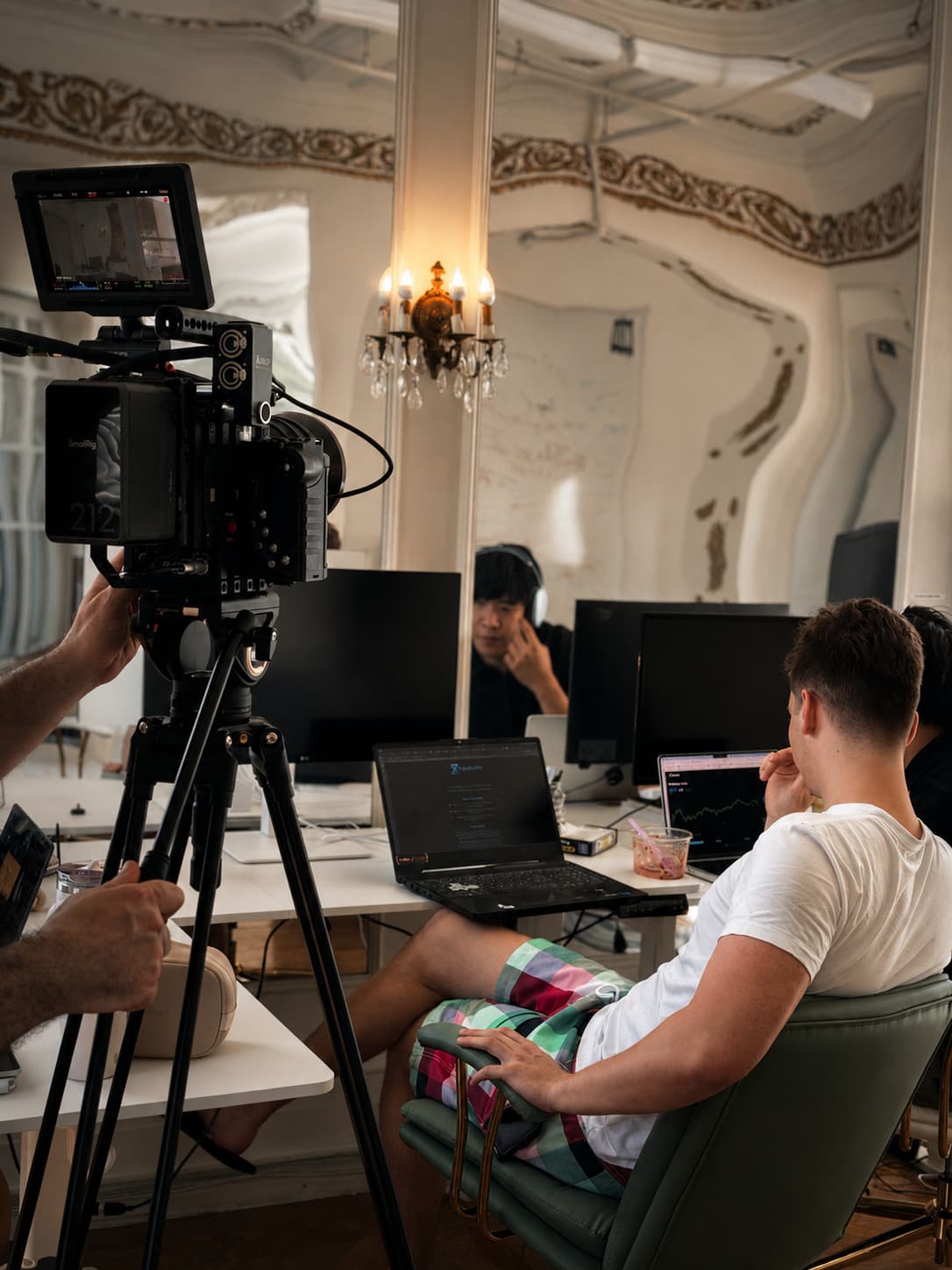 Shooting a seated scene in a salon room, camera and monitor in the foreground